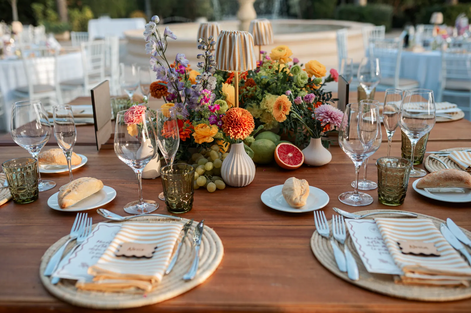 Banquet table set with colourful flowers
