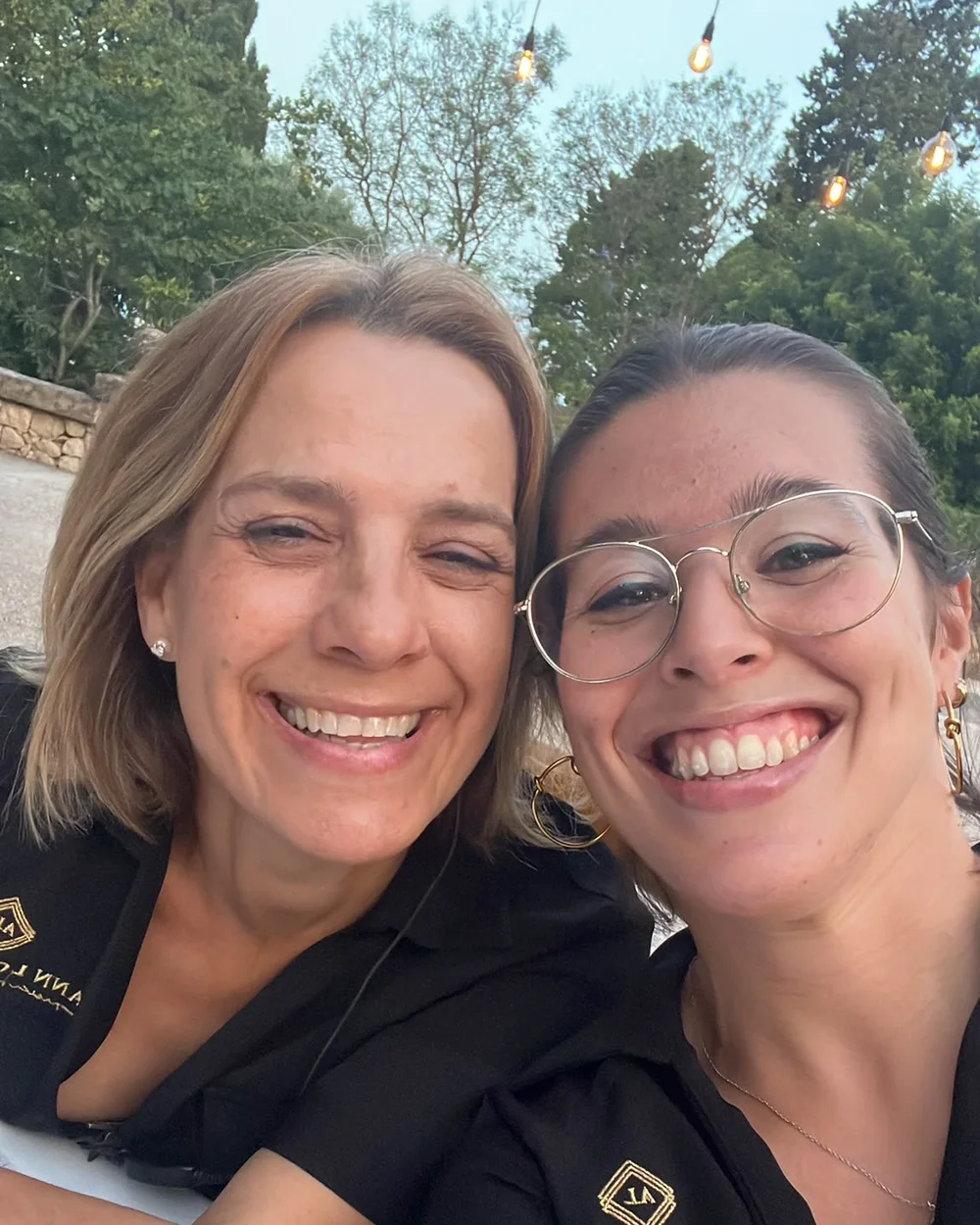 Ana and Silvia from Ann Lo Events, smiling at a wedding