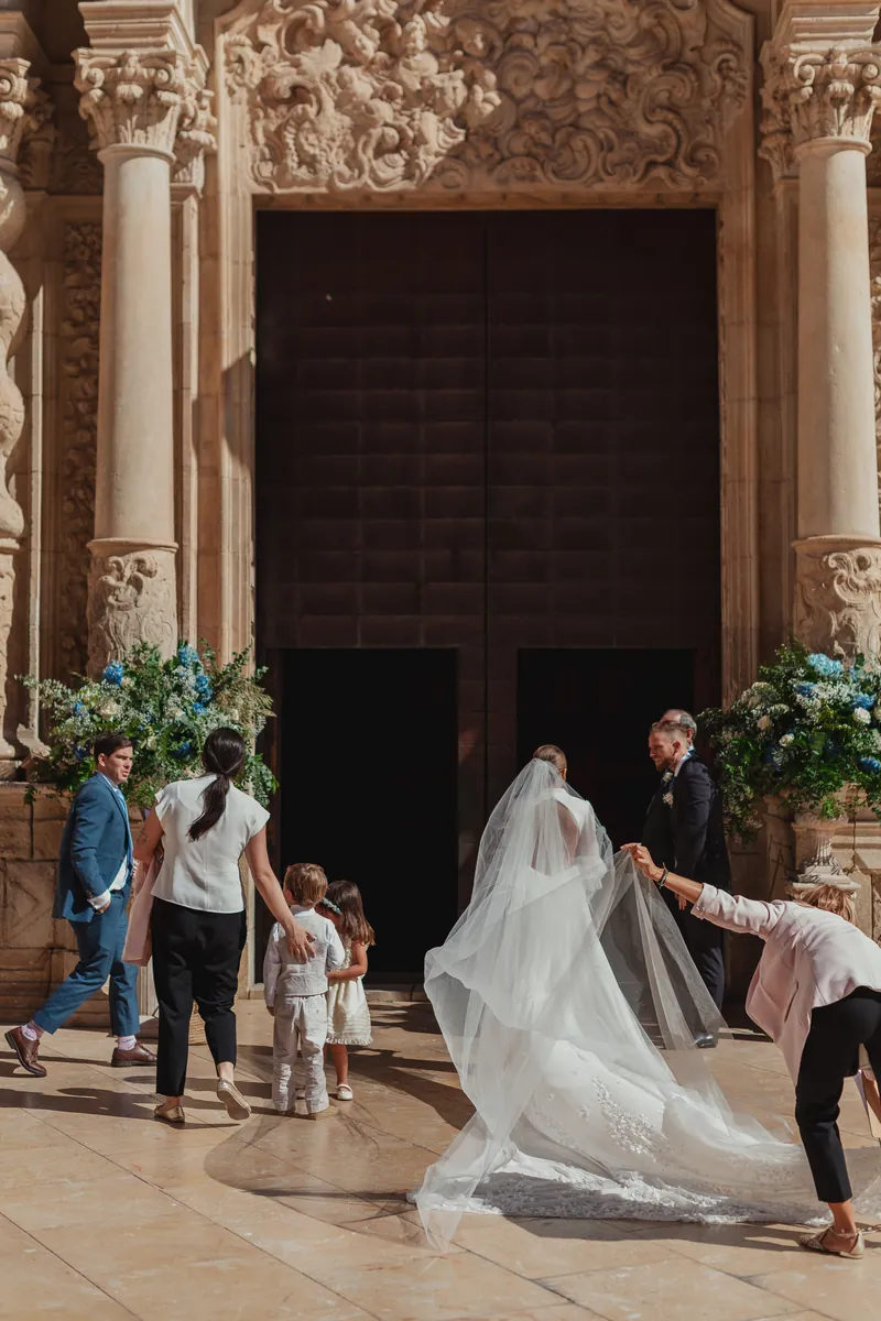 Bride walking in with a long veil